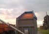 Тонар-95234 Самосвальный полуприцеп с лючками и желобом для перевозки зерна